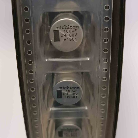UUH1K101MNQACTNS 100MF 80V 12x12 NICHICON SMD KONDANSATÖR resmi